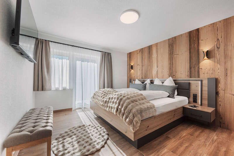 Bedroom with double bed and balcony