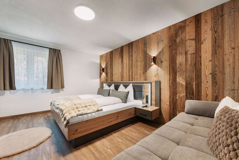 Triple room with a view of the bed from the couch