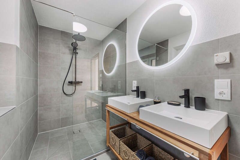 Bathroom with shower and double sink